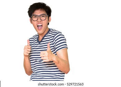 Studio shot of happy nerd guy giving thumbs up isolated against white background