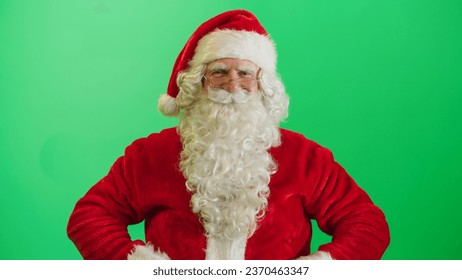 Studio Shot Isolated Mockup Template: Jolly Santa Claus Standing On Green Screen Chromakey Background With Hands Crossed, Looks At The Camera Cheerfully. Christmas, New Year, Celebration - Powered by Shutterstock