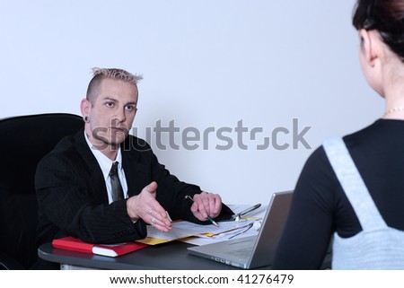 studio shot of isolated picture of a strange caucasian businessman with piercing and tattoos
