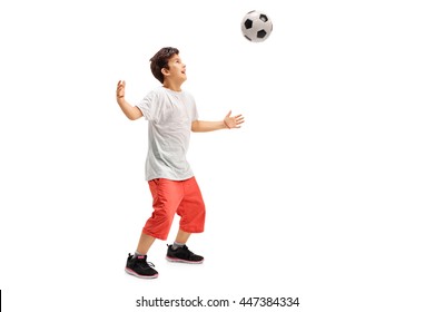 Studio Shot Of A Joyful Kid Playing Football Isolated On White Background