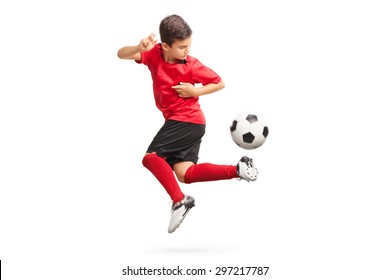 Studio shot of a junior soccer player performing a trick with a soccer ball isolated on white background - Powered by Shutterstock