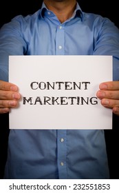 Studio Shot Of Man Holding White Sign With The Word Content Marketing