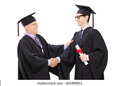 Studio Shot Of A Mature University Dean Congratulating A Young Student On His Graduation Isolated On White Background