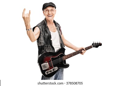 Studio Shot Of An Old Punk Rocker Holding A Bass Guitar And Making A Rock Gesture Isolated On White Background