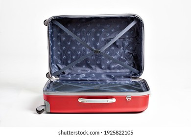Studio shot of an open red suitcase