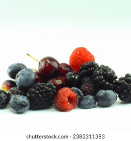 Studio shot photo of dark berries juicy tasty berry medley assortment mixed
