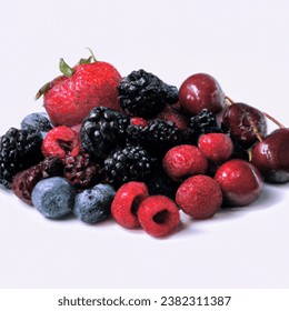 Studio shot photo of dark berries juicy tasty berry medley assortment mixed
