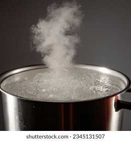 Studio shot photo of a large pot of hot water boiling