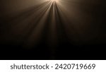 Studio shot of projector haze isolated on black background. Warm light rays shining from above with smoke mist in darkness.