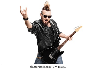 Studio shot of a punk rock guitarist playing guitar and making rock gesture isolated on white background