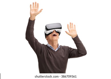 Studio Shot Of A Senior Man Using A VR Headset Isolated On White Background