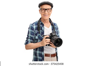 Studio shot of a senior photographer holding a black camera isolated on white background - Powered by Shutterstock