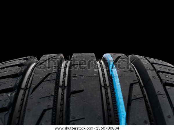Studio shot of set of summer car tires on black
background. Tire stack background. Car tyre protector close up.
Black rubber tire. Brand new car tires. Close up black tyre
profile. Car tires in a
row