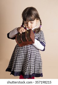 Studio Shot Of Small Iraqi Girl Holding Wooden Box 