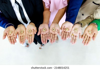 Studio Shot Of Small Wooden Cube Block Thank You Letters Alphabets Hold In Hands By Unrecognizable Unidentified Faceless Officer Staff In Business Wears Show Appreciation To Customers Or Colleagues.