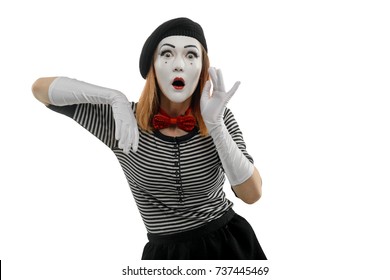 Studio Shot Of Surprised Woman, Isolated On White. Female Mime Artist Is Leaning On Imaginary Box, Monkeying A Woman Who Loves Gossip. Pantomime Concept.