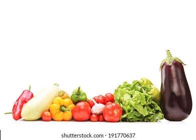 Studio shot of a table full of vegetables isolated on white background