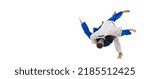 Studio shot of two men, professional judo athletes training isolated over white background. Sweeping hip throw. Concept of martial art, combat sport, health, strength, energy. Copy space for ad, flyer