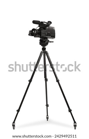 Studio shot of a video camera on a tripod stand isolated on white background