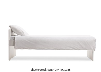 Studio Shot Of A White Single Bed With A Cotton Duvet Cover Isolated On White Background