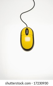 Studio Shot Of Yellow Computer Mouse Against White