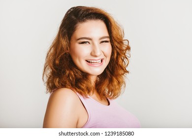 Studio Shot Of Young 20-25 Year Old Woman, Bright Red Hair, Pink Lipstick