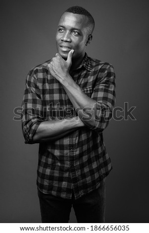 Similar – Image, Stock Photo African student with a bald head wearing a white shirt