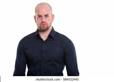 Studio shot of young bald muscular man - Shutterstock ID 584532445