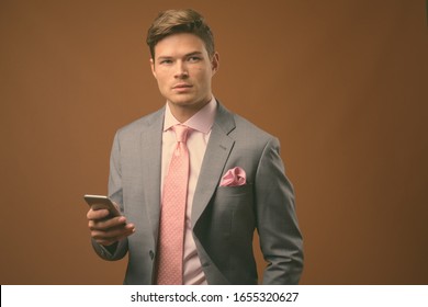 pink and brown suit