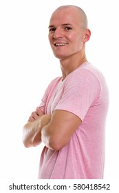 Studio Shot Of Young Happy Bald Man Smiling With Arms Crossed