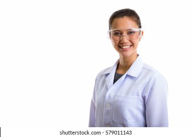 Studio shot of young happy woman doctor smiling while wearing protective glasses - Powered by Shutterstock