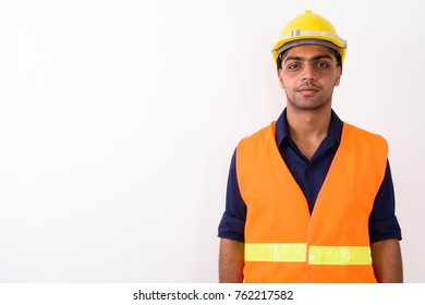 Studio Shot Of Young Indian Man Construction Worker Against White Background