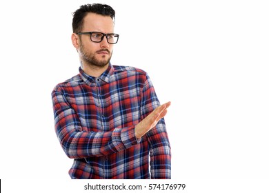 Studio Shot Of Young Man With Stop Hand Sign