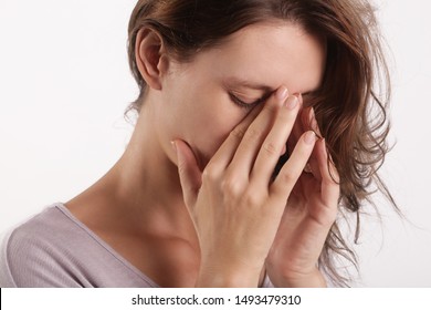 Studio Shot Of A Young Woman Suffering From Symptoms Of Sinus Infection (Sinusitis)