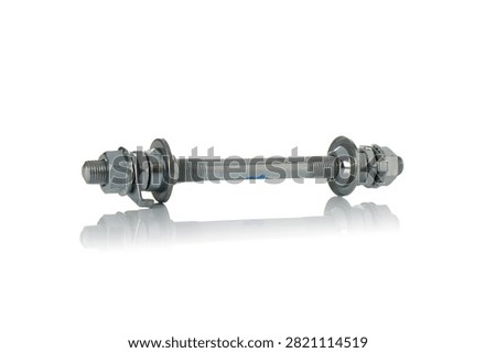 Studio side view of assembled steel bicycle wheel hub axle shaft featuring threaded rod construction, adjustable bearing cones, locknuts, safety retainers, dust caps, and soft bottom reflection on isolated white background showcasing cycling repair hardware.