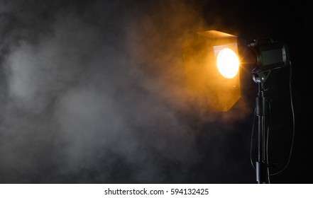 Studio Spot Light With Smoke Effect On Black Background