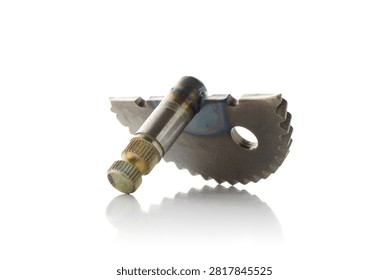Studio three quarter perspective view of motorcycle kickstart shaft assembly featuring welded steel gear quadrant sector, splined drive spindle, and heat treatment discoloration, shot on reflective white background showcasing scooter engine starting mechanism.
