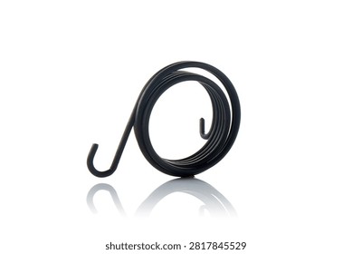 Studio three quarter perspective view of heavy duty black coated steel kickstarter return torsion spring featuring coiled wire loops, double hook anchoring ends, shot on reflective white background showcasing scooter engine starter mechanism hardware.