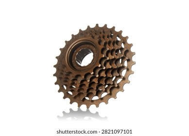 Studio three quarter perspective view of bronze multi speed bicycle freewheel cassette featuring steel gear sprockets, threaded hub core mechanism, polished metallic texture, and soft bottom reflection on isolated white background showcasing cycling drivetrain components.
