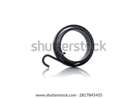 Studio three quarter perspective view of heavy duty black steel kickstarter return torsion spring featuring coiled wire loops, curved anchoring hook end, shot on reflective white background showcasing scooter engine starting mechanism hardware.