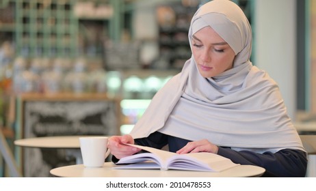 Studious Young Arab Woman Reading Book 
