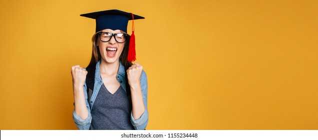 Study, Education, University, College, Graduate Concept On Yellow Banner. Happy And Excited Portrait Of Young Blond Student Girl In Hat Of Graduation Isolated 