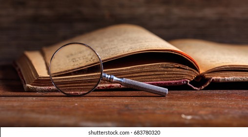 Study in history. Vintage history book and magnifying glass on wooden background
 - Powered by Shutterstock