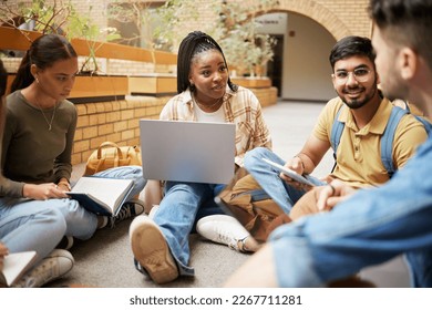 Study, laptop and group of students research, planning or learning ideas, communication and teamwork in university. Project, education and college diversity friends or people collaboration in school - Shutterstock ID 2267711281