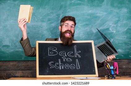 Study With Us. Private School Advertising Boost Enrollments. Teacher Or School Principal Welcomes Blackboard Inscription Back To School. Teacher Welcomes Pupils Study Traditional And Modern Subjects.