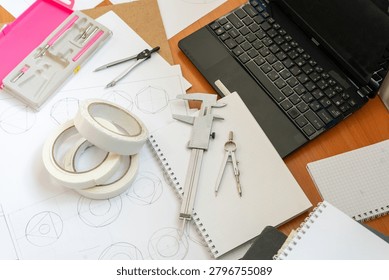 Study Workspace Laptop, Technical Drawings, Vernier Caliper, Compasses Stationery Tool Top view architect desk Geometric sketches dividers. Professional engineering and drafting