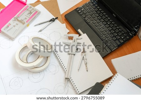 Study Workspace Laptop, Technical Drawings, Vernier Caliper, Compasses Stationery Tool Top view architect desk Geometric sketches dividers. Professional engineering and drafting