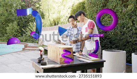 Studying dad-son checking plans at poolside, in plaid, pink tee, with bench, drill and AR shapes. Backyard, patio, woodworking, diy, collaboration, blueprints, augmentedreality