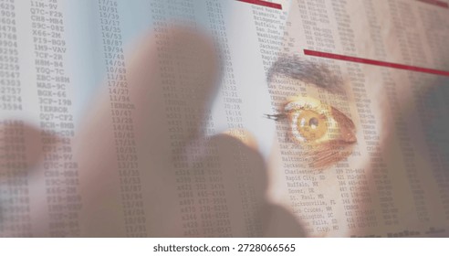 Studying eye peering through translucent sheet at desk, fingertip pointing red lines, copy space. Data, display, finger, face, focus, office, analytics