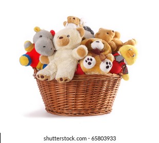 Stuffed animal toys in a basket isolated on a white background - Powered by Shutterstock